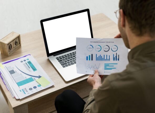 man-working-with-infographics-indoors