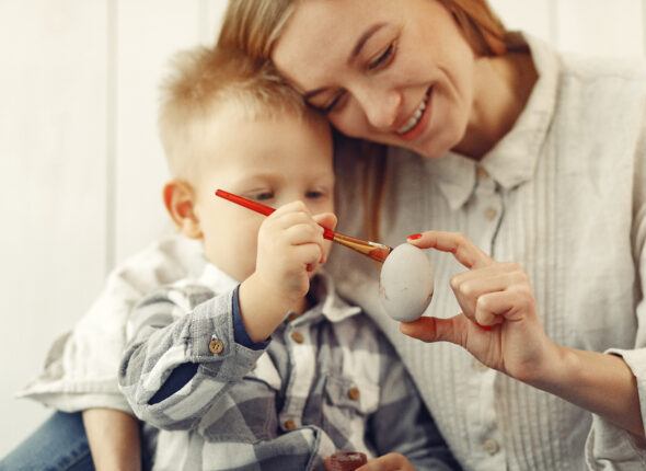 Mother with son at home prepare to easter