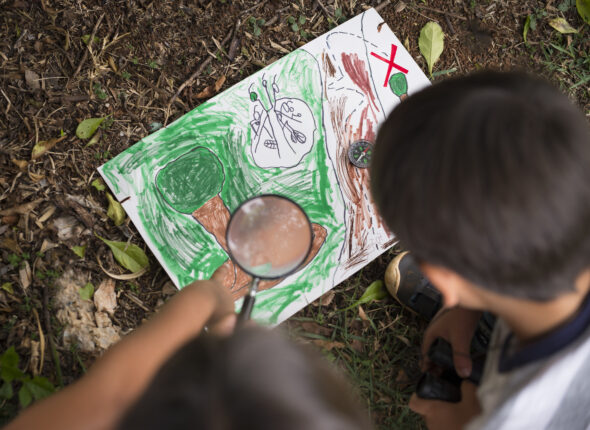 best-friends-participating-treasure-hunt-outdoors