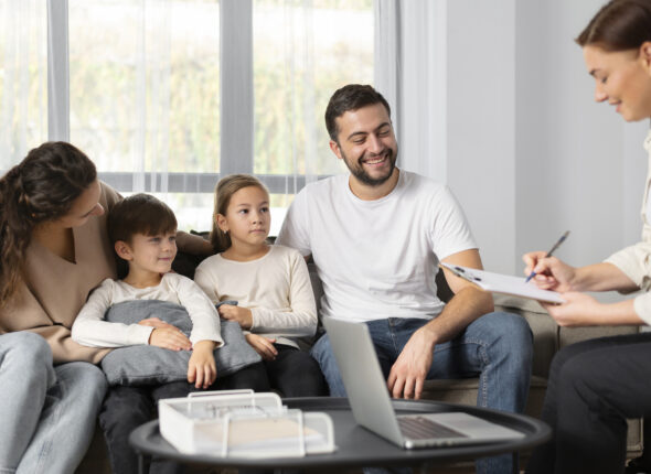 close-up-family-talking-therapist