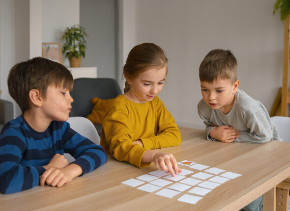 medium-shot-children-playing-memory-game