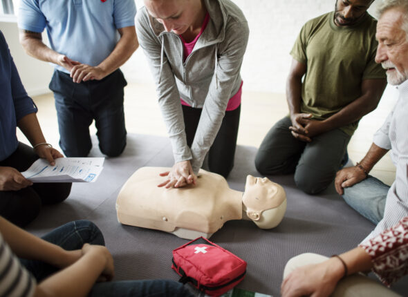 Group of diverse people in cpr training class